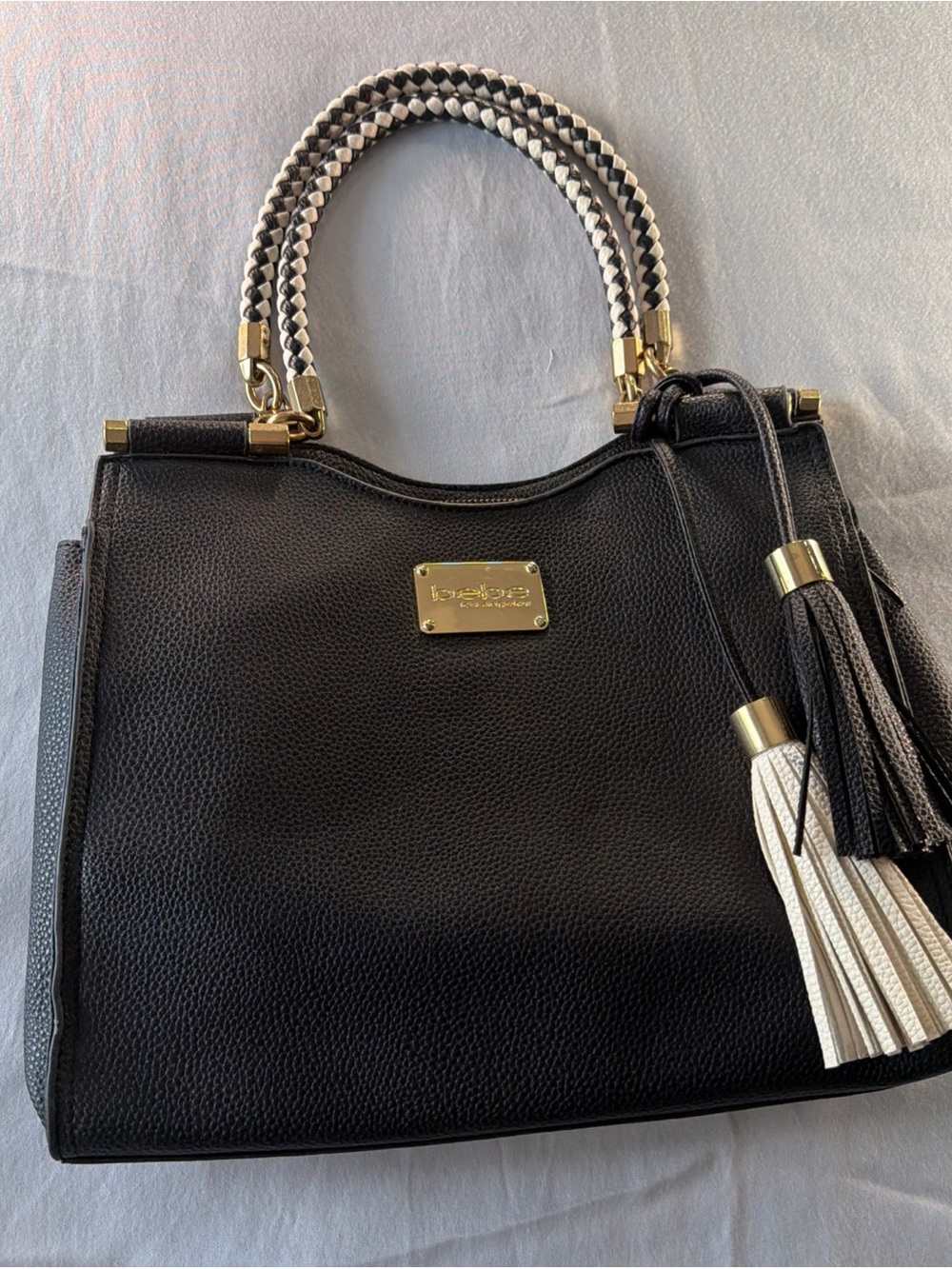 bebe Black Satchel with Braided White-and-Black Handles and Tassels